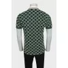 Men's green polo shirt with signature monogram