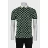 Men's green polo shirt with signature monogram