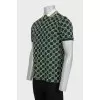 Men's green polo shirt with signature monogram
