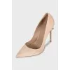 Suede pumps with embellished heels