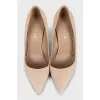 Suede pumps with embellished heels