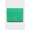 Textile wallet with a button