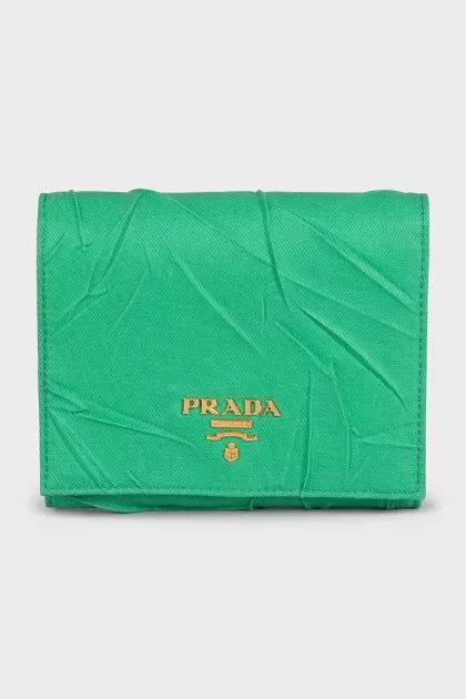 Textile wallet with a button