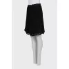 Pleated skirt decorated with lace