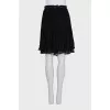 Pleated skirt decorated with lace