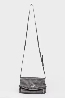 Black leather handbag on a zipper and button