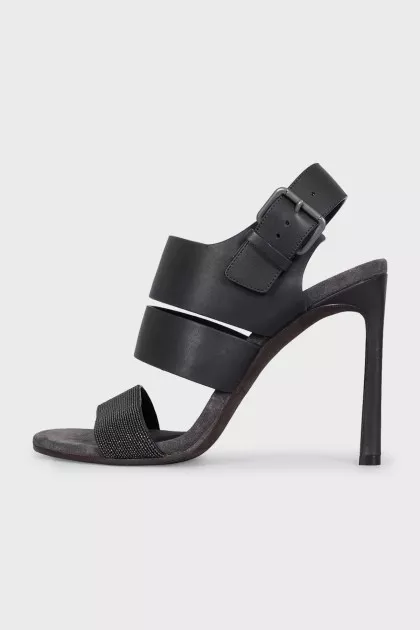 Black leather sandals with a decorated strap