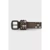 Leather belt decorated with spikes
