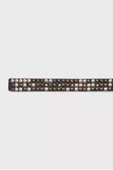 Leather belt decorated with spikes