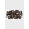 Leather belt decorated with spikes