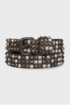 Leather belt decorated with spikes