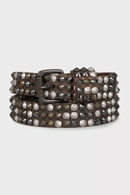 Leather belt decorated with spikes