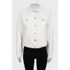 White denim jacket with gold buttons