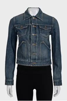 Blue denim jacket with a distressed effect