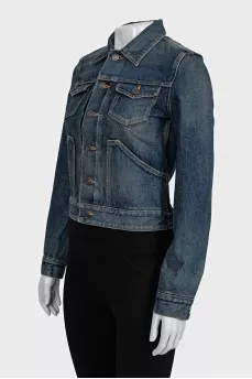 Blue denim jacket with a distressed effect