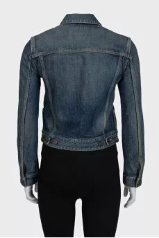 Blue denim jacket with a distressed effect