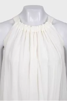 White pleated sleeveless blouse