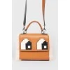 Brown bag with fur and Lego inserts
