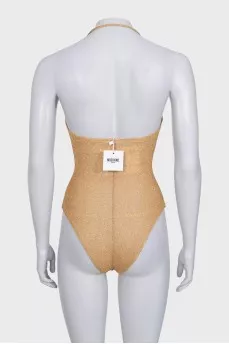 Gold swimsuit with tag