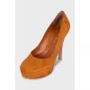 Orange suede heeled shoes