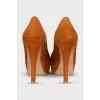 Orange suede heeled shoes