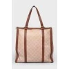Brown bag with leather inserts, on the handles
