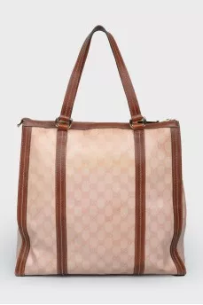 Brown bag with leather inserts, on the handles