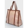 Brown bag with leather inserts, on the handles