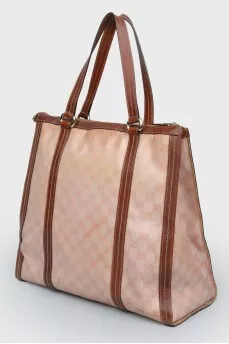 Brown bag with leather inserts, on the handles
