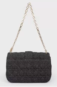 Black leather handbag on a golden chain
