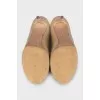 Beige leather shoes with decorated heels