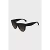 Sunglasses with a combined frame
