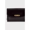 Leather crossbody with signature embossing