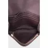 Leather crossbody with signature embossing