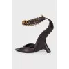 Leather sandals with a shaped wedge heel