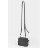 Black leather handbag with metal fittings