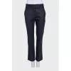 Straight-leg blue trousers with a mid-rise