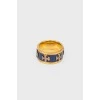 Golden ring with blue insert