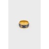 Golden ring with blue insert