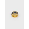 Golden ring with blue insert