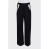 Black straight-leg trousers with cutouts