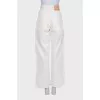 White high-waisted jeans with embroidery