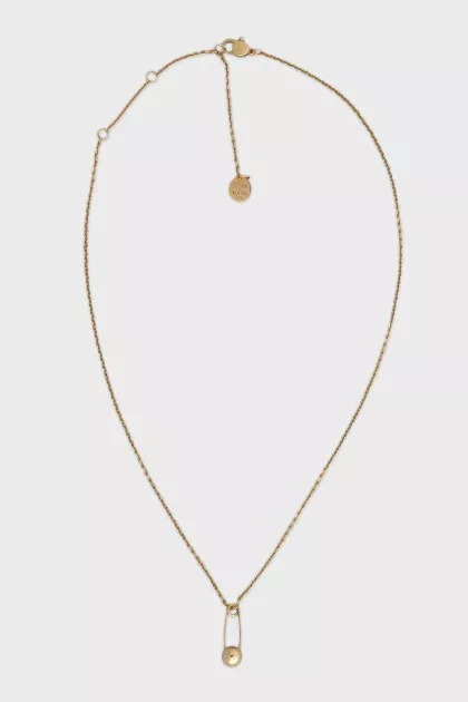 Gold necklace with a pin