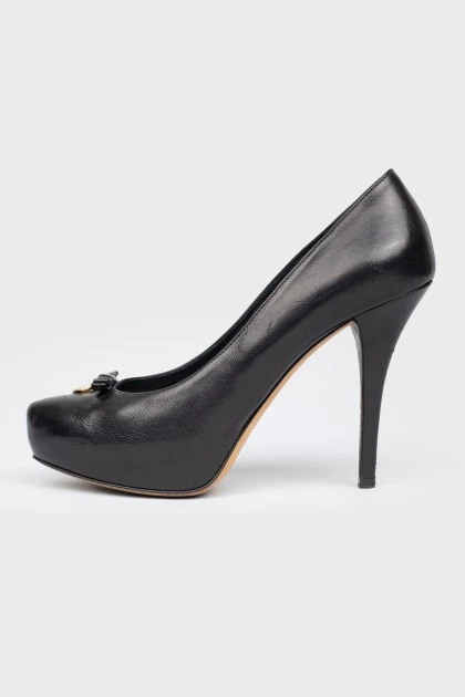 Black leather shoes with stiletto heels