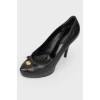 Black leather shoes with stiletto heels
