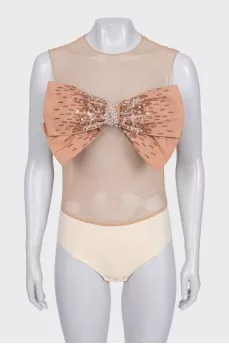 Beige bodysuit with a voluminous bow