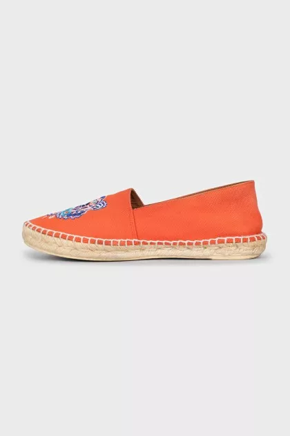 Orange moccasins with embroidery