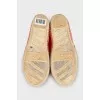 Orange moccasins with embroidery