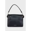 Leather shoulder bag with patch pockets