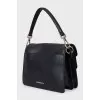 Leather shoulder bag with patch pockets